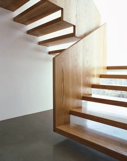 White oak custom wooden open riser staircase with long panel handrails from wood as well